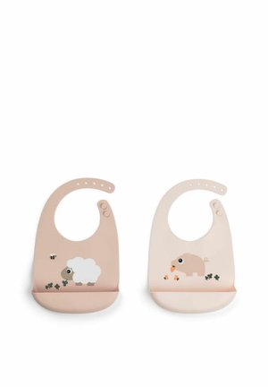 Two silicone baby bibs with snap closures, one beige with sheep and bee, the other light pink with pig and carrots, both with food-catching pockets.