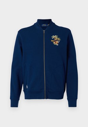 Navy zip-up sweatshirt made of cotton, featuring a palm tree and surfboard embroidered design on the left chest and side pockets.