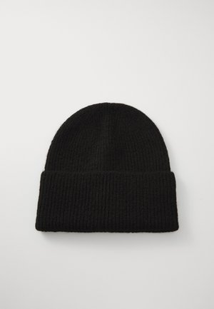 Black ribbed knit beanie with a rolled cuff, made of textured fabric. Round shape, suitable for cold weather wear.