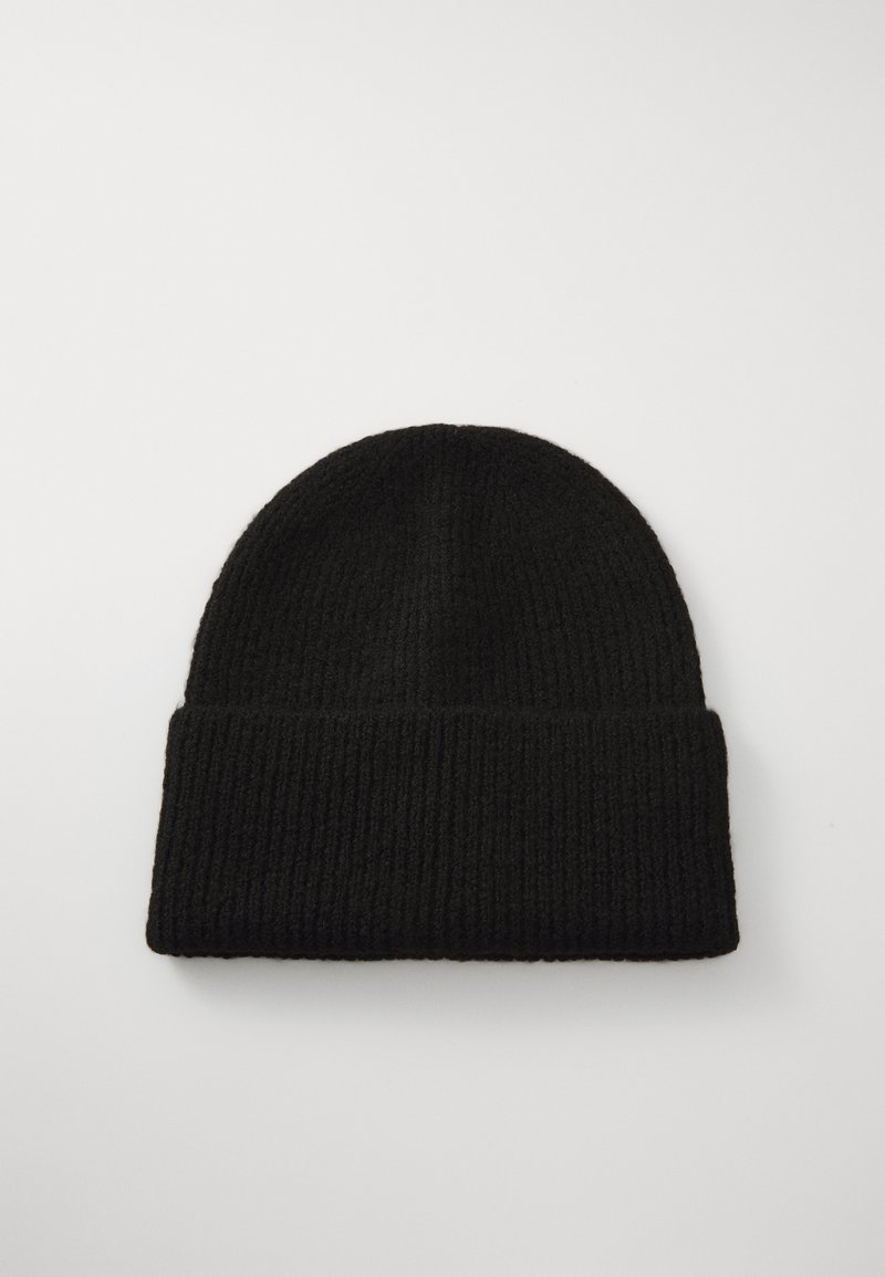 Black ribbed knit beanie with a rolled cuff, made of textured fabric. Round shape, suitable for cold weather wear.