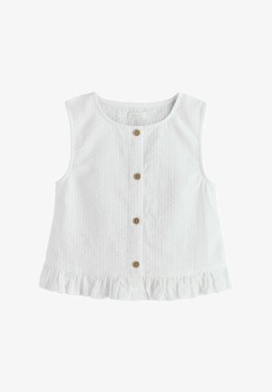 Besiūlis baltas kūdikio marškinėlių viršus su tekstūruota medžiaga, priekyje mediniai mygtukai, apvali iškirptė ir raukšlėta apačia.