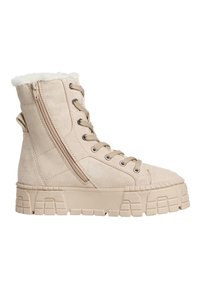 Bottes montantes en suede beige avec une doublure blanche en peluche, dotées d'un lien à l'avant et d'une fermeture éclair sur le côté, semelle épaisse texturée.