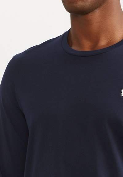 Navy long-sleeve t-shirt made from smooth cotton, featuring a ribbed crew neckline and a small white embroidered logo on the chest.