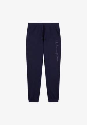 Joggers navy avec une taille élastique, un cordon de serrage, des chevilles resserrées, des poches latérales et un logo "Champion" imprimé le long de la jambe gauche.