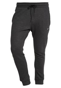 Mörkgrå sweatpants i mjukt material, med dragsko i midjan, tapered ben och en liten logotyp framtill.