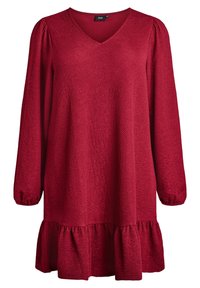 Sarkana tunika kleita ar garām piedurknēm, V veida kakla izgriezumu, tekstilā ar faktūru un viļņotu apakšmalu. Iespējami savelkti piedurkņu gali un brīvs piegriezums.