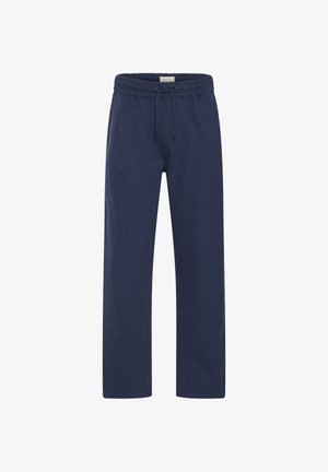 Tengerészkék színű tréningnadrág megkötős derékkal, egyenes szárakkal és puha tapintású anyaggal. Két oldalzsebbel és laza kialakítással rendelkezik.