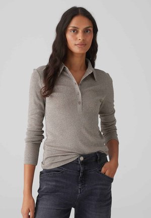 Long-sleeve polo shirt in metallic grey, featuring a button-down collar, textured fabric, and a fitted design. Paired with dark denim jeans.