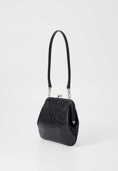 Black crocodile-embossed handbag with a structured shape, silver clasp hardware, and a thin, curved strap. Smooth texture.