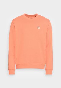 Koraalkleurige sweatshirt van een zachte katoenen mix, met een ronde hals, geribbelde manchetten en een klein vierkant logo op de borst.