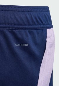 Navy athletic shorts with a textured waistband, featuring ClimaCool branding and light purple mesh side accents for breathability.