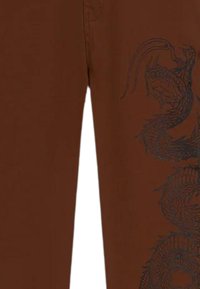DOLLY NOIRE SNAKE CARPENTER - Pantaloni - bro