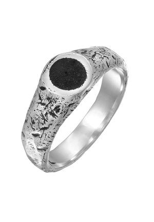 Silver ring featuring a textured, rugged design with a prominent black circular stone centerpiece, showcasing a mix of polished and matte finishes.