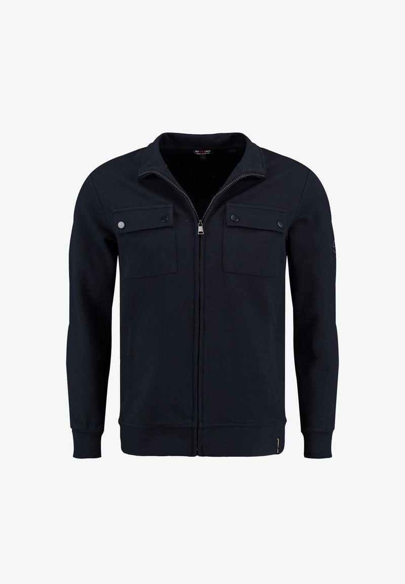 Sweat-shirt zippé bleu marine en tissu texturé. Comporte deux poches avant avec rabats et un logo discret sur le côté inférieur gauche.