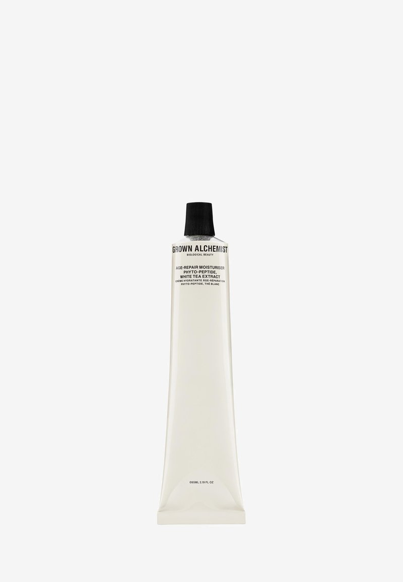 White plastic tube with a tapered design, black twist cap, and black text. Contains age-repair moisturizer with white tea extract. 65 ml.