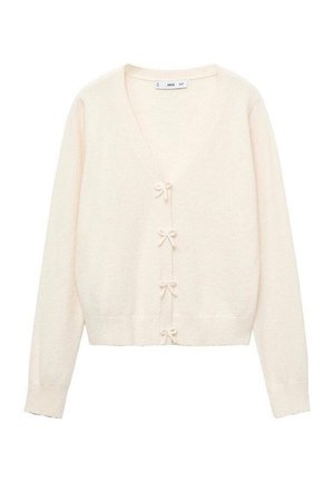 Licht perzikkleurige cardigan met een V-hals, lange mouwen en zes knopen bevestigd met kleine strikjes. Zacht textuur en verkorte design.