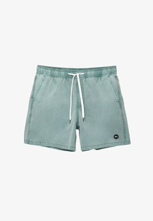 Costume da bagno verde chiaro realizzati in tessuto morbido, con vita elastica e cordino bianco, e tasche laterali. Piccolo logo sull'orlo.