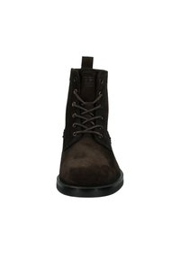 Brown suede ankle boots with a round toe, lace-up front, and looped pull tab at the back. Features a textured surface and black rubber sole.