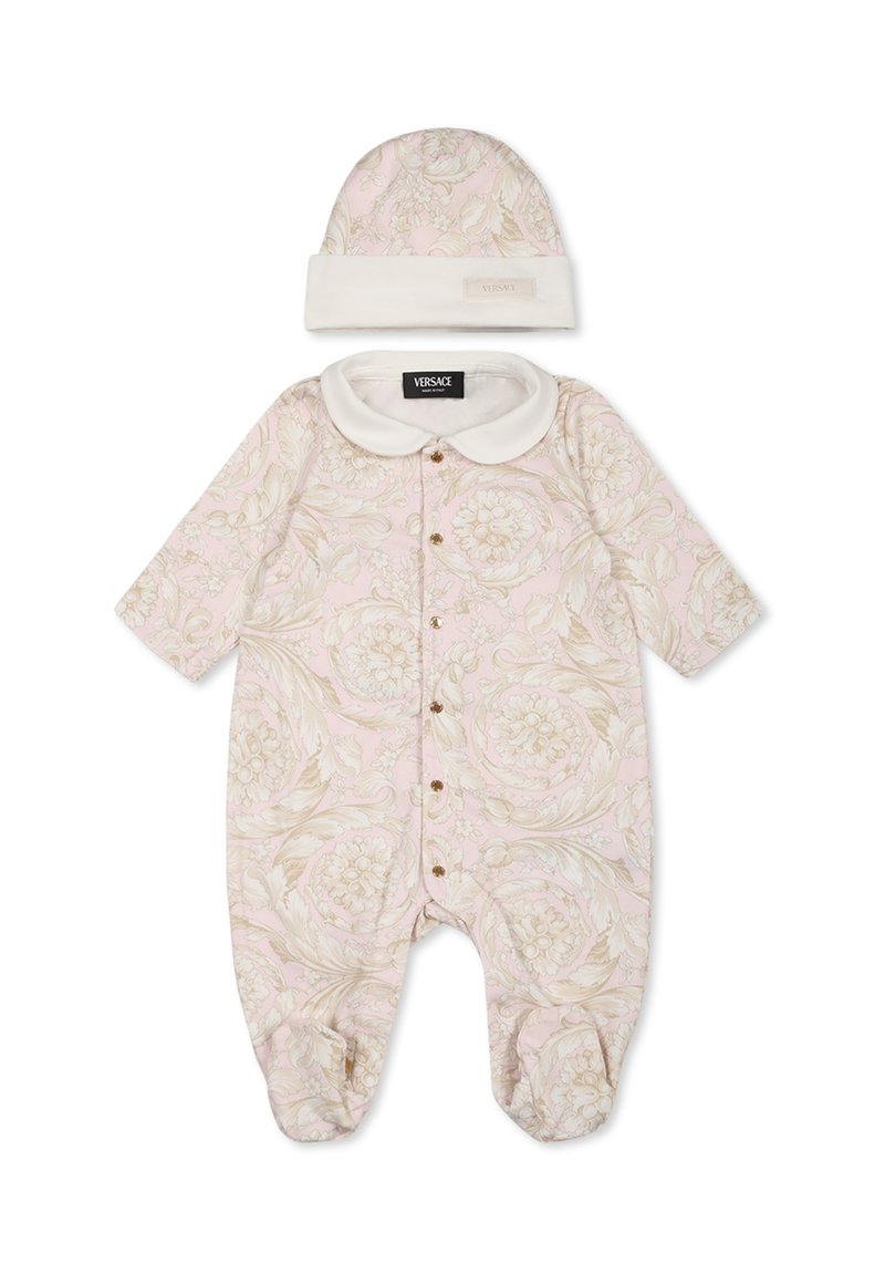 Un body à motif floral rose avec des manches courtes, featuring un col blanc et des boutons à pression dorés. Comprend un chapeau assorti rose et blanc.
