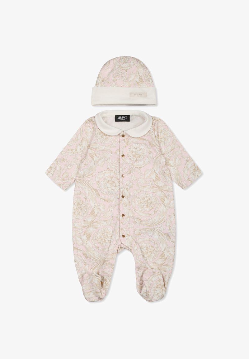 Body a maniche corte con motivo floreale rosa, dotato di colletto bianco e bottoni a pressione dorati. Include un cappellino abbinato rosa e bianco.