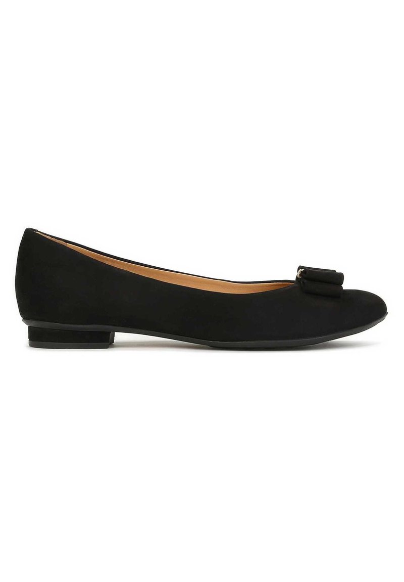 Black ballet flat with a smooth texture, rounded toe, low heel, and a small bow accent on the front. Interior features a beige lining.