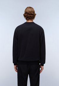 Black crewneck sweatshirt made of soft fabric, featuring ribbed cuffs and hem, with a relaxed fit and plain texture.