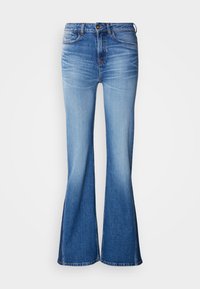 Μπλε τζιν παντελόνια καμπάνα με μέση μέτριας ανόδου, ραφές σε αντίθεση και ελαφριά ξεθώριασμα. Κλασικός σχεδιασμός με πέντε τσέπες και κλείσιμο με κουμπί.