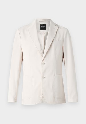 Beiger Blazer mit einreihigem Design, zwei Fronttaschen, Reverskragen und Knopfverschluss. Glatte Textur mit taillierter Passform.