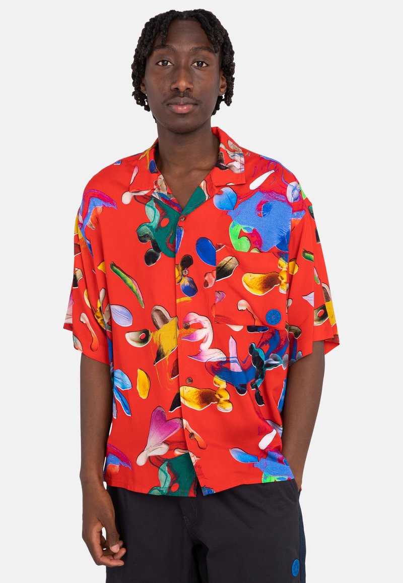 Red short-sleeve shirt featuring an abstract pattern in various colors. Made of smooth fabric with a button-down front and pocket.