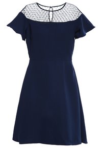 Merenneito mekko lyhyillä hihoilla, läpikuultava verkko-osa mustilla pilkuilla ja avokytkentä selässä, valmistettu kevyestä kankaasta.