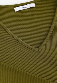 Olive green ribbed fabric with a V-neckline. Features vertical stripes and a flat seam finish. Brand tag labeled "NEXT" at the neckline.