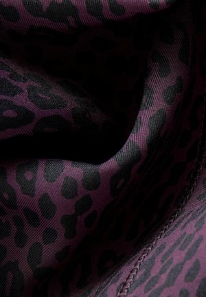 Leopard print fabric in purple and black, featuring a soft texture with smooth, flowing lines and contrasting patterns throughout.