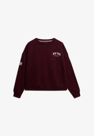 Bordeaux sweatshirt met ronde hals, verlaagde schouders en ribgebreide manchetten. Heeft "NEW YORK" en "Squady" geborduurd in het wit.