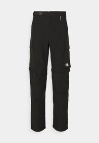 Svarta cargobyxor med bälte, flera fickor och en logotag på det nedre benet. Tillverkad av ett hållbart, slätt tyg.