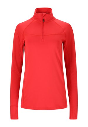 Haut de sport féminin rouge vif à manches longues avec un col zippé quart et des poignets avec ouverture pour le pouce.