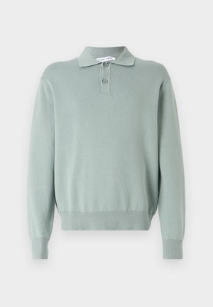 Light green knitted pullover with a polo collar, two buttons, ribbed cuffs, and hem. Soft texture and relaxed fit.