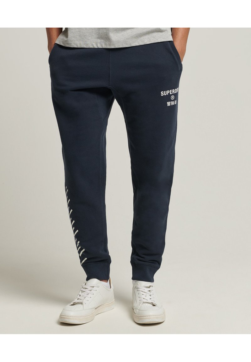Superdry Tracksuit bottoms eclipse navy/blue Zalando.co.uk