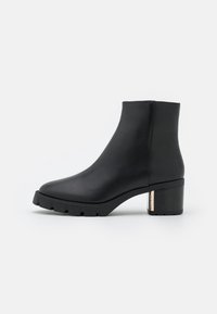 COACH Botines con plataforma - black