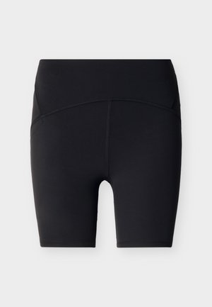 Schwarze Biker-Shorts mit hoher Taille, flachen Nähten und mittlerer Oberschenkellänge, präsentiert vor einem schlichten, hellen Hintergrund.