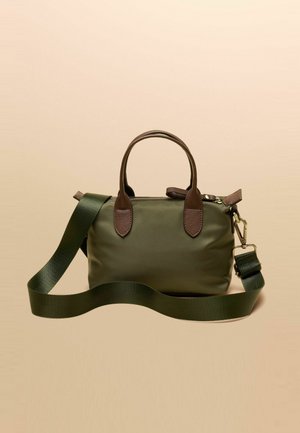 Green nylon handbag with brown leather accents, dual top handles, and a detachable shoulder strap. Smooth texture, rectangular shape.