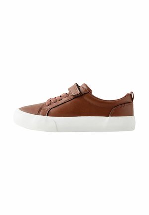 Brown leather sneaker with a white rubber sole, featuring lace-up closure and a Velcro strap. Smooth texture with a rounded toe design.