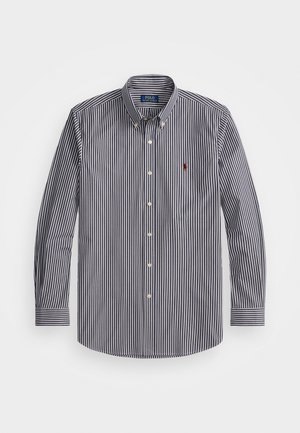 Navy and white striped long-sleeve shirt made of cotton, featuring a button-down collar, white buttons, and a small red logo on the chest.