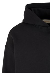 Black hoodie with a soft texture, featuring a large hood and drop shoulder design. Fabric is lightweight and smooth, with minimal detailing.