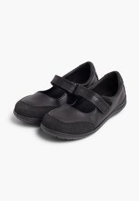 Pantofi negri cu talpă plată, fabricați din piele și textil. Au vârf rotunjit și o curea cu arici pe partea superioară.