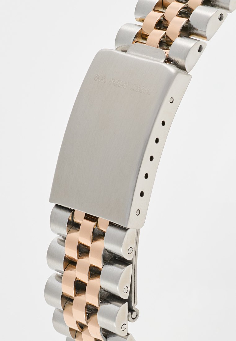 Boucle et bracelet en acier inoxydable et or rose, avec gravure U.S. Polo Assn. sur la boucle.