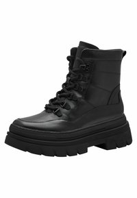 Bottines en cuir noir avec des semelles épaisses et texturées. Les caractéristiques incluent des œillets en métal, des lacets et un col rembourré pour un meilleur soutien.
