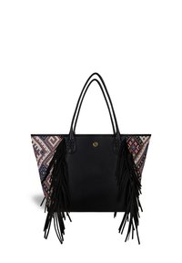 Black tote bag with colorful woven side panel, fringes, and braided accents on handles. Geometric pattern in pink, blue, and cream tones.