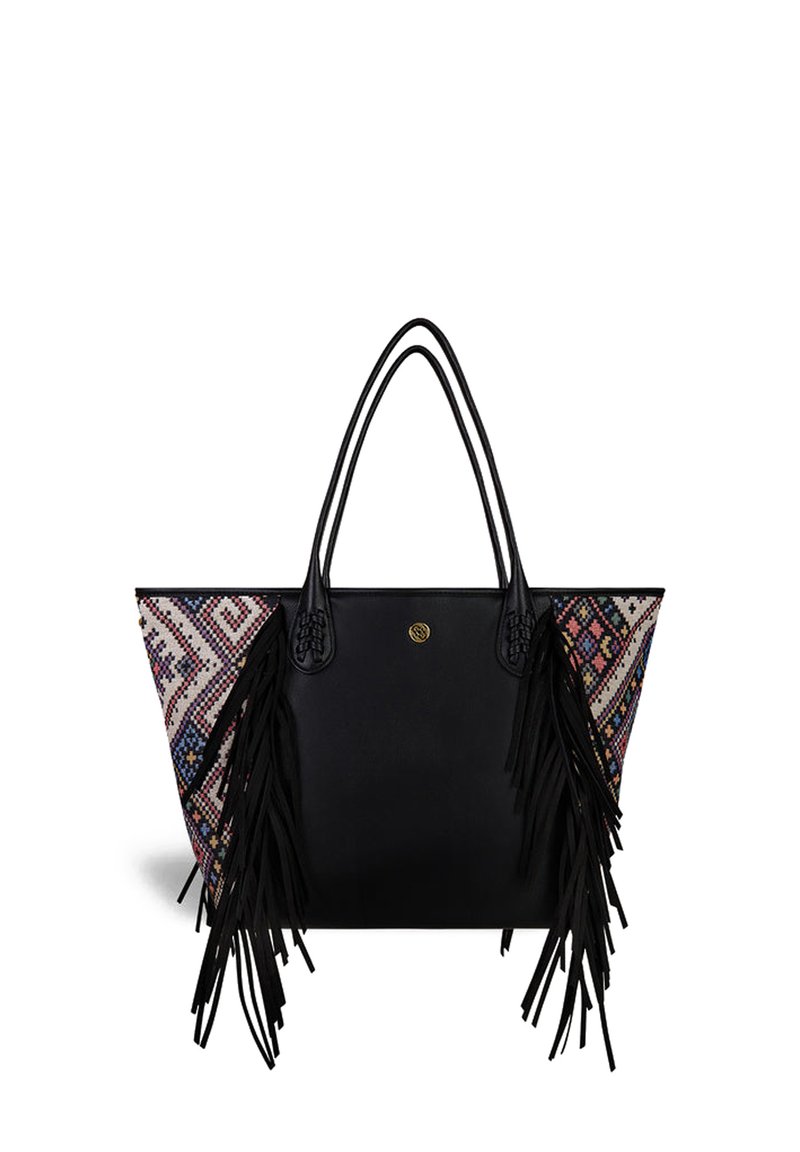 Black tote bag with colorful woven side panel, fringes, and braided accents on handles. Geometric pattern in pink, blue, and cream tones.