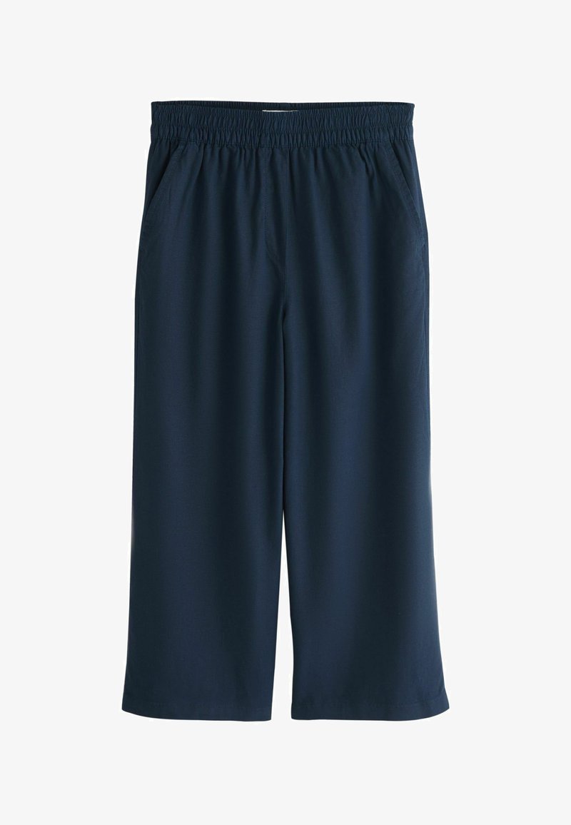 Pantalon court à jambes larges bleu marine avec taille élastique et poches latérales, en tissu léger.