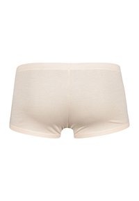 Beige bavlněné boxerky s nízkým pasem. Mají hladkou texturu a elastický pas. Bez dekorativních akcentů nebo vzorů.